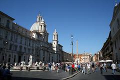 Southeast side of Piazza Navona in Rome featuring Fontana del Moro, Fontana dei Quattro Fiumi, and Sant'Agnese in Agone