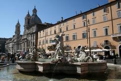 North-west side of Piazza Navona in Rome with Nettuno fountain and Church of St. Agnes in Agona