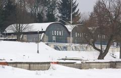 Emptied Brněnská přehrada reservoir with boating sports halls