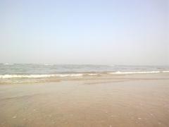 Aksa Beach in early morning with calm waves and clear sky