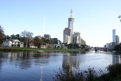 Boathouses in Alexandra Gardens, Melbourne across the Yarra River with Eureka Tower under construction in the background