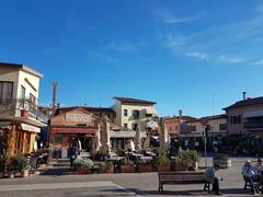 Coastal view of Caorle with colorful buildings and a sandy beach