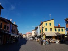 Scenic view of the colorful buildings and waterfront in Caorle, Italy