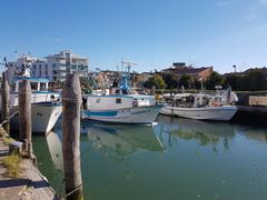 Caorle waterfront with colorful buildings and sandy beach