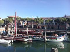 Caorle waterfront with colorful buildings and clear blue sky