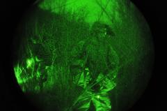 U.S. Army paratrooper patrols hilltop during training in Italy