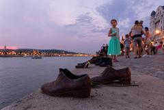 Girl contemplates Shoes on the Danube Bank in Budapest, Hungary