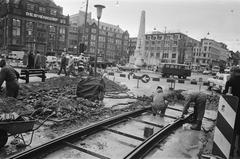 Construction of tram tracks on Dam Square, Amsterdam, January 12, 1977