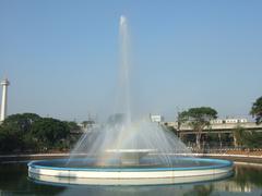 fountain by the Istiqlal Mosque in Jakarta with Monas in the background