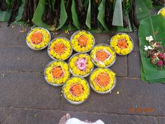 Close-up of thalams with offerings