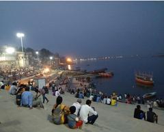 Assi Ghat in Varanasi with people by the River Ganga