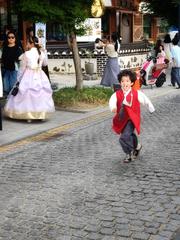 A boy wearing traditional Korean hanbok in Gyeongju