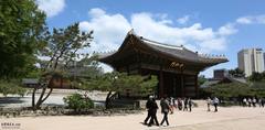 Seoul Deoksugung Palace after April showers with a wet stone courtyard and traditional architecture