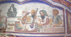 fresco of Sikh ragi jatha playing traditional instruments with Guru Amar Das