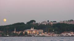 Istanbul at night with illuminated buildings and water reflections