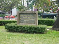 Banjasiri Park in Bangkok with green lawns, trees, and a pond