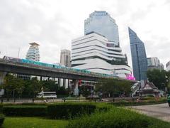 Banjasiri Park in Bangkok featuring a fountain and lush greenery