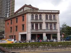 A three-story structure with a viewing platform on the roof, combining Chinese and Western architectural elements.