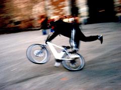 Acrobatic cyclist at Sforza Castle entrance