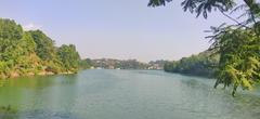 Scenic view of Bhimtal Lake surrounded by lush greenery