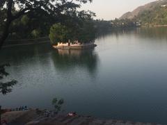 Scenic view of Bhim Taal lake surrounded by hills