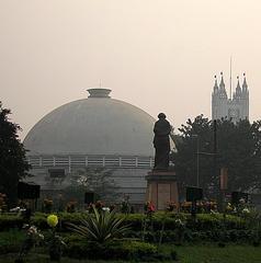 Birla Planetarium with statue of Indira Gandhi and St Paul's Cathedral in the background, Kolkata