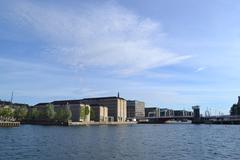 Copenhagen canal with boats and historic buildings