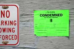 Condemnation notice on Liberty Warehouse east wall in Durham