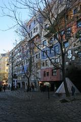 Hundertwasser Building with colorful facade and unique architectural design featuring irregular shapes and vibrant hues