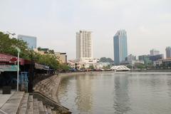 Boat Quay in Singapore with waterfront buildings and boats