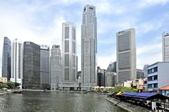 Boat Quay, Singapore waterfront with traditional shophouses and modern skyscrapers