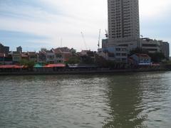 Scenic view of Boat Quay in Singapore with colorful buildings and boats on the river