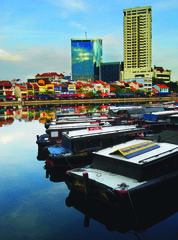 View of Boat Quay from Raffles Landing site with bumboats on Singapore River