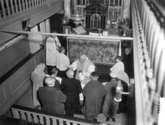 75th anniversary of the Amstelkring, Amsterdam, with Mgr. J. P. Huibers during holy communion, January 9, 1959