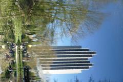 Dammtoranlagen at Planten un Blomen park in Hamburg with Radisson Blu hotel reflection in Wallgraben