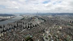 Aerial shot of Seoul with urban buildings and greenery