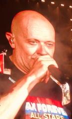 Max Pezzali performing live on stage in 2024