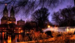 Bow Bridge in Central Park with Upper West Side Residential Area in the background