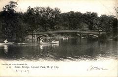 Bow Bridge in Central Park with a scenic view of the water and trees