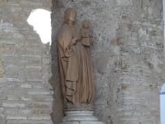 Virgen con el Niño sculpture near the Puerta del León at Alcázar of Seville