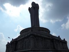 Buddha statue under cloudy sky at Lumbini Park