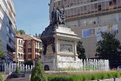 Plaza Isabel la Catolica with bronze sculpture of Queen Isabella and Christopher Columbus in Granada