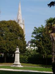 Public garden of Marennes with statue of Charles-Esprit Le Terme and Marennes church bell tower