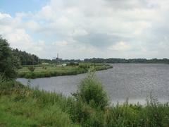 Scenic view of Den Ilp with a windmill in the distance