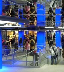 Main hall of Münchner Freiheit subway station with blue columns