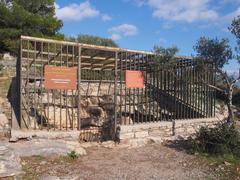 Protective cage at the entrance of Nympholeptos cave