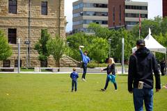 A person throwing a frisbee on grass