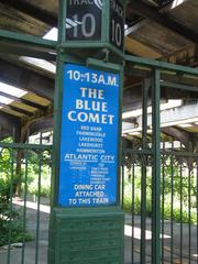 Abandoned Central Railroad of New Jersey terminal with track designators separated from disused tracks by a fence