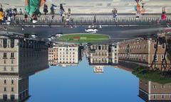 Piazza Venezia in Rome with historical buildings and statues