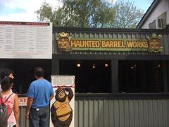 Haunted Barrel Works exterior at night with spooky decorations